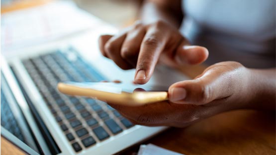 A patient's hands dialing on smart phone