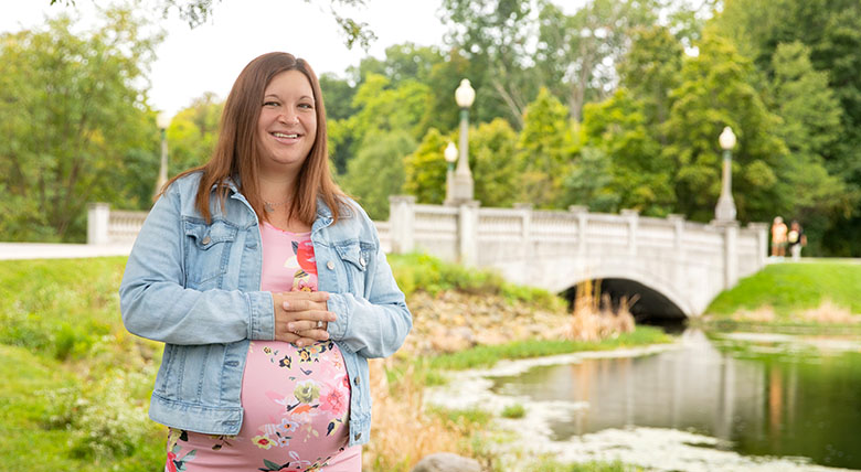 Grove City Hospital patient Kayla Gregorish smiling at the camera outdoors.